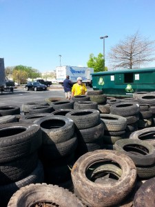 Chapter Member, Jimmy Fanny, shown here stacking tires.